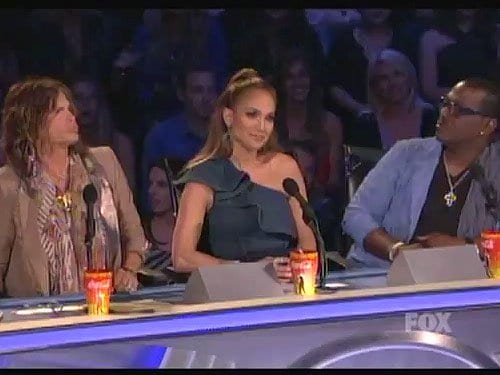 Jennifer Lopez sitting between Steven Tyler and Randy Jackson as she gives her criticisms on American Idol on May 12, 2011