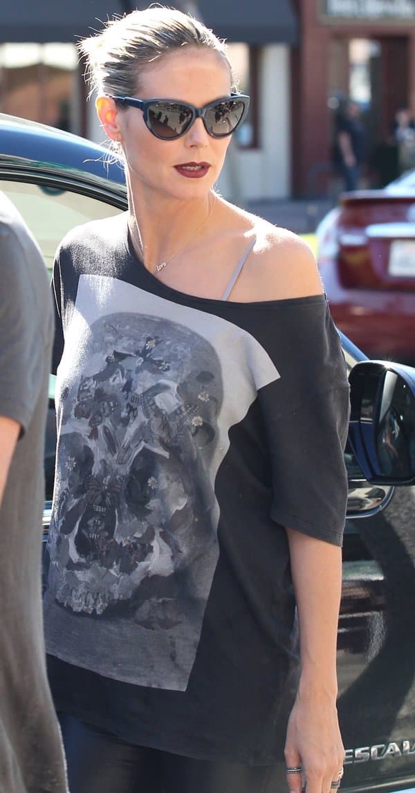 Heidi Klum rocks an off-shoulder printed black shirt