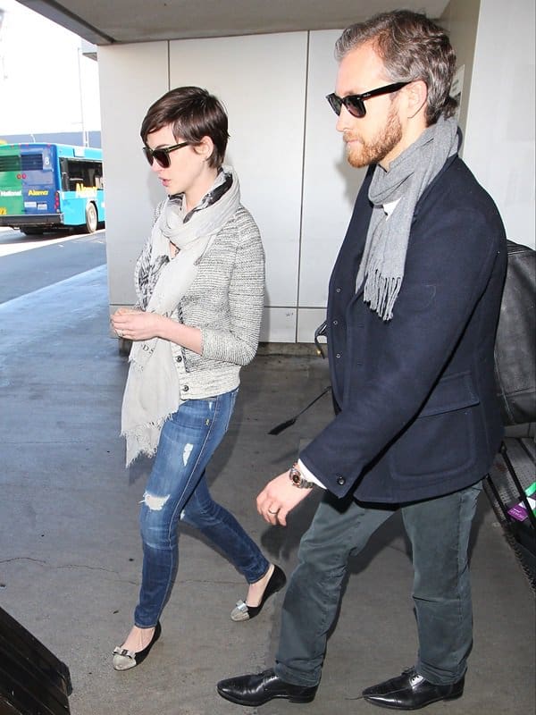 Anne Hathaway and husband Adam Shulman arrive at LAX Airport