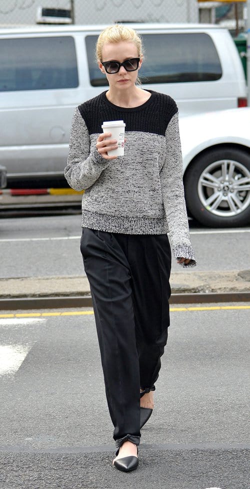 Carey Mulligan with a cup of coffee and on her way to go with friends in the West Village