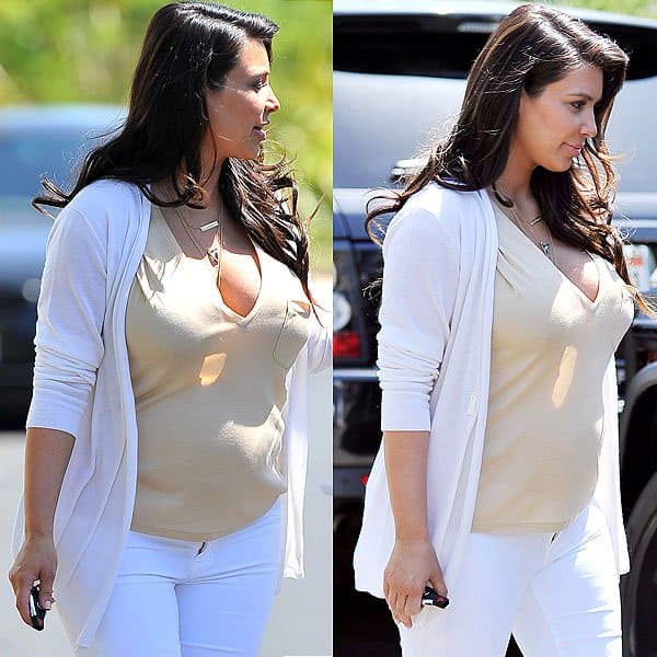 Kim Kardashian wearing white maternity jeans