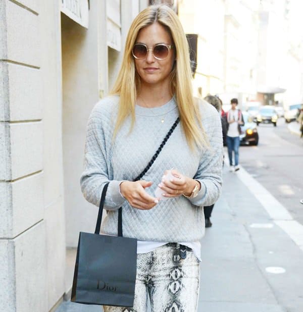 Bar Refaeli styled her skinny snakeskin-printed jeans with a Chanel bag and a gray knit sweater by Umit Benan