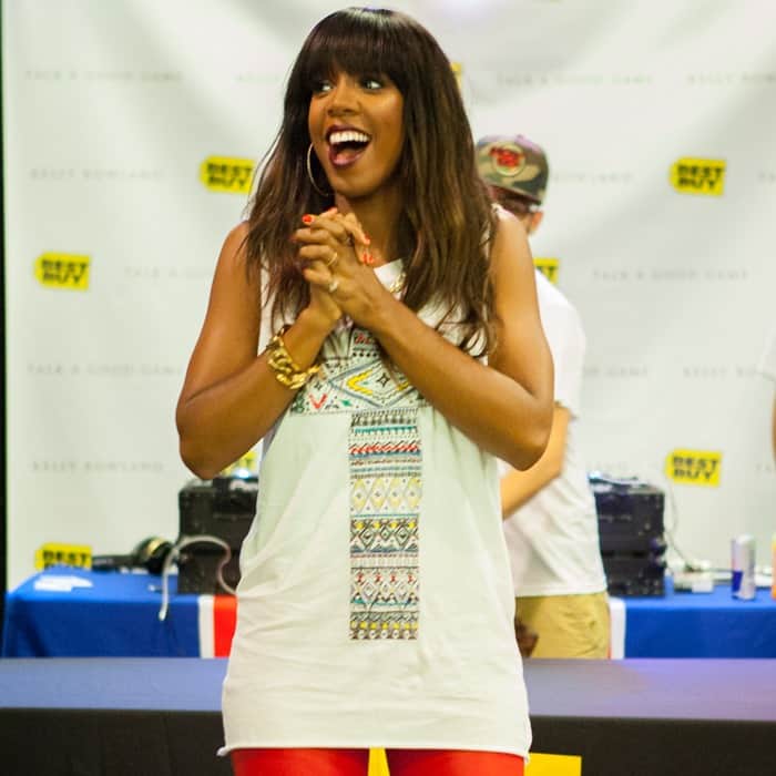 Kelly Rowland styled a rock-meets-street outfit with an embroidered cross tank