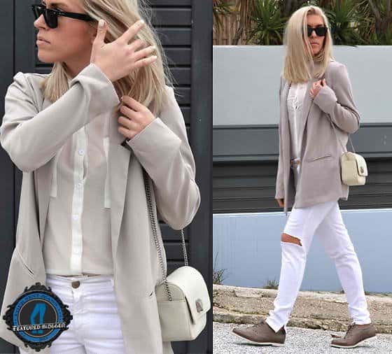 Dena wearing white distressed jeans with an oversized blazer