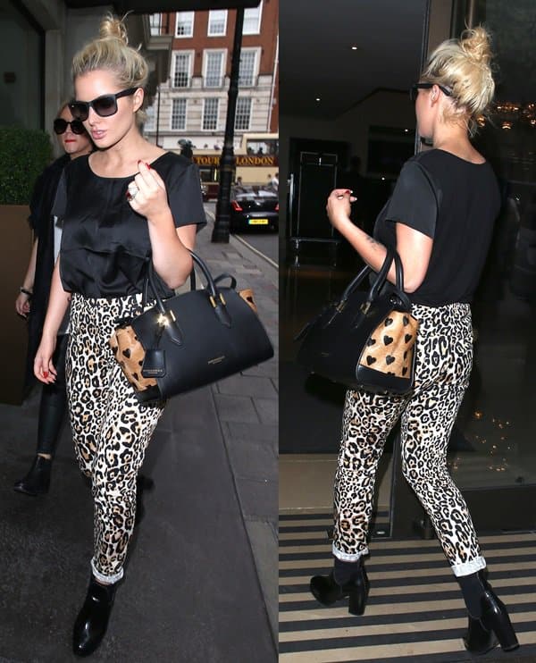 Helen Flanagan covered up for once in a shimmery black top, ankle booties, and leopard-printed jeans