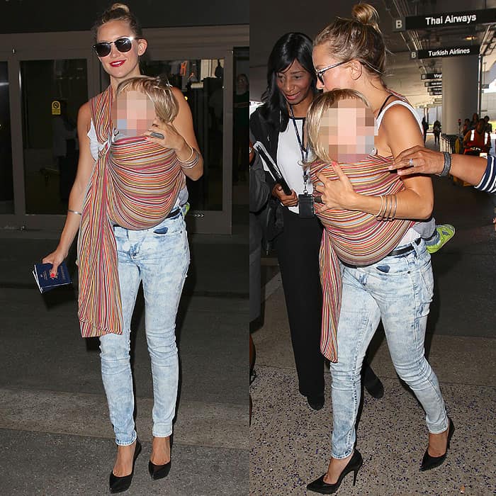 Kate Hudson, carrying son Bingham Hawn Bellamy, arriving at LAX in Los Angeles, California, on July 30, 2013