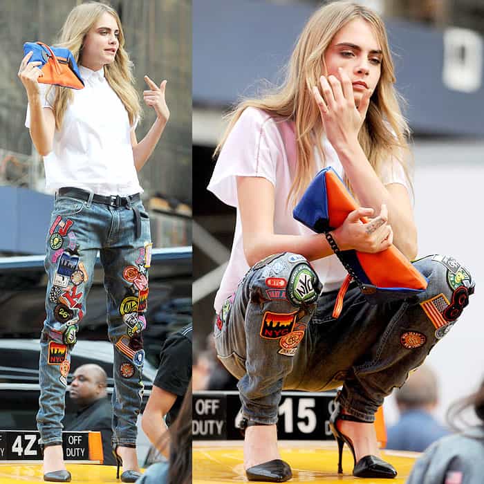 Cara Delevingne posing on top of a yellow cab at a DKNY photoshoot in Times Square in New York City on October 14, 2013