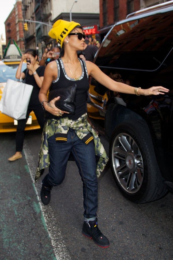 Style up your boyfriend jeans with a tank top and a camo print jacket like Rihanna