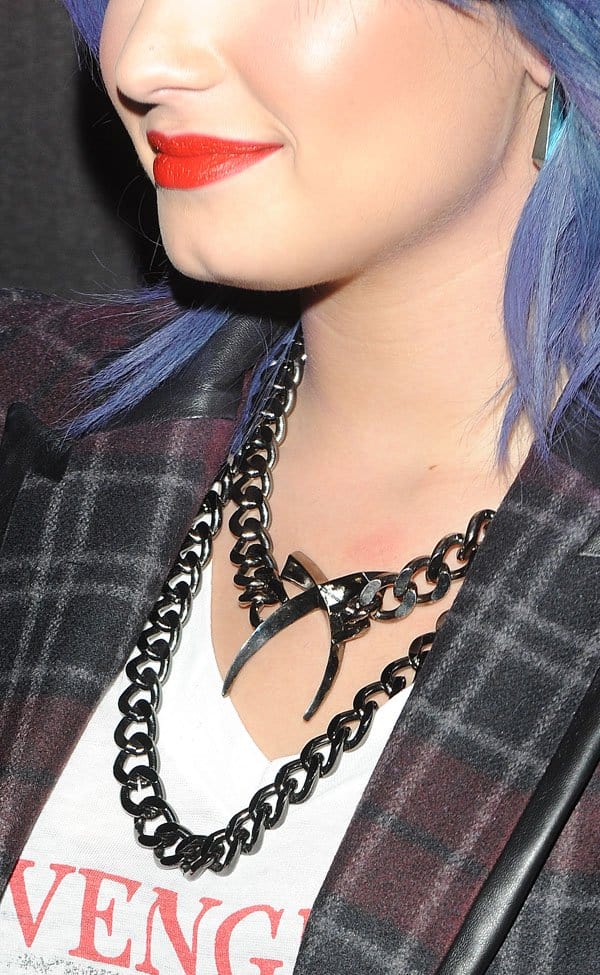 Demi Lovato accessorized with a cross tusk necklace from Luv AJ