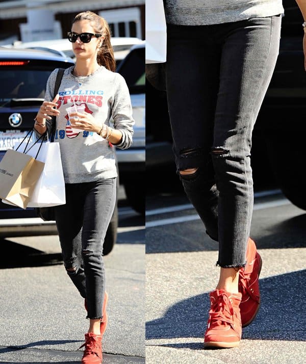Alessandra Ambrosio wears J Brand Photo Ready cropped skinny jeans with Isabel Marant's Betty leather and suede wedge sneakers