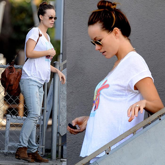 Olivia Wilde covers up her baby bump in a vintage MTV T-shirt and skinny jeans