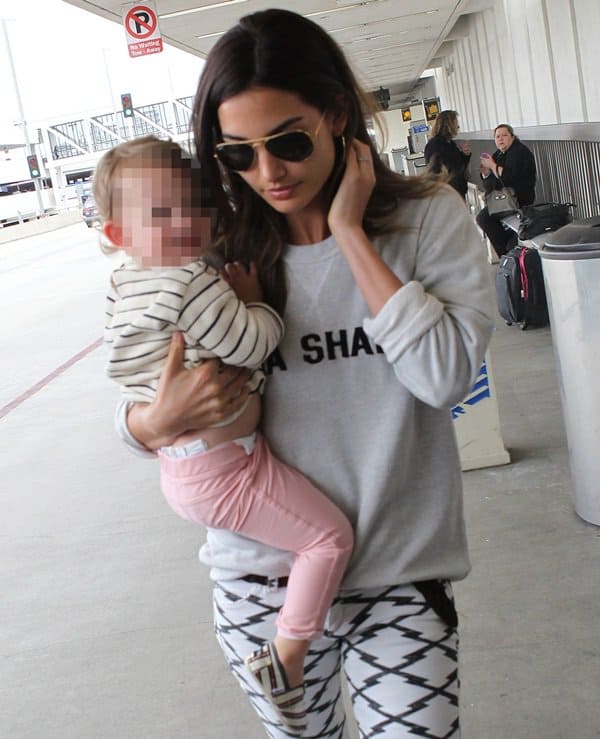 Lily Aldridge arriving at Los Angeles International Airport (LAX) with her daughter Dixie Pearl Followill