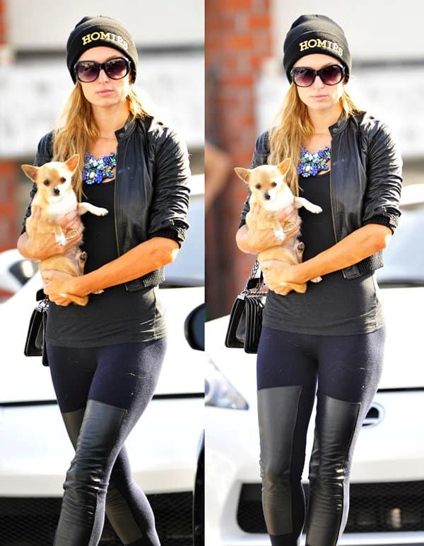 Paris Hilton rocks black skinny leather chap jeans by R13 while arriving at Meche Salon