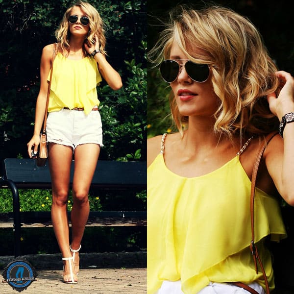 Petra flaunts her legs in a bright yellow top with denim cut off shorts