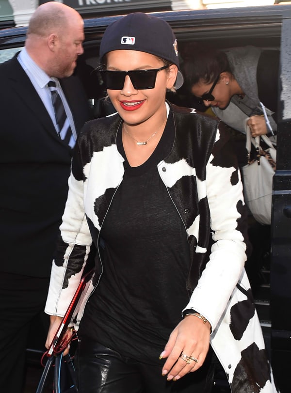 Rita Ora's Givenchy cow print coat and black sweatshirt