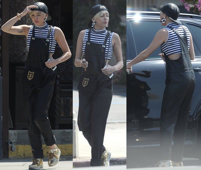 Miley Cyrus' luxurious leather Elizabeth and James overalls are finished with a rich sateen backing