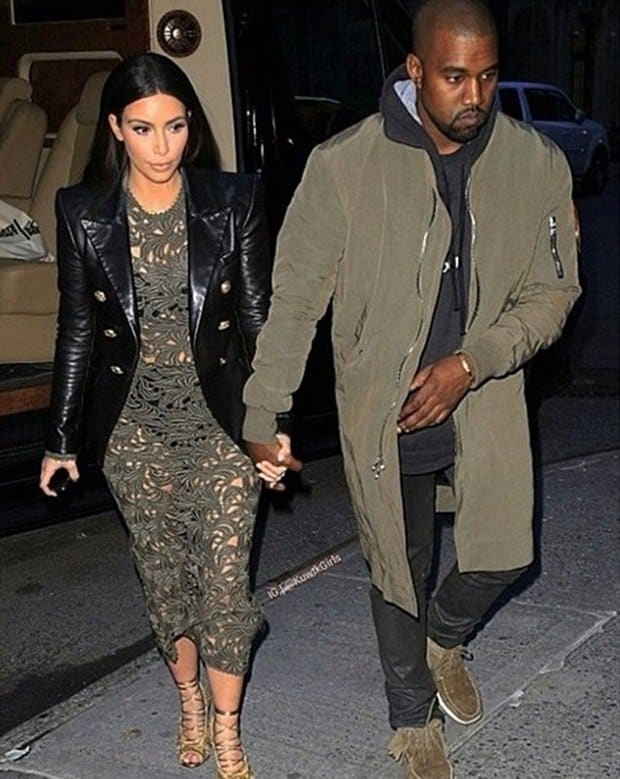 Kanye West and Kim Kardashian out with their daughter, North West, in Paris on September 28, 2014