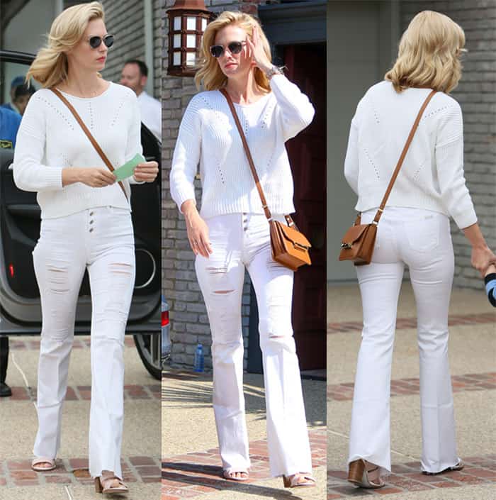 January Jones in white flared jeans with ripped thighs at Memorial Day Party hosted by Joel Silver
