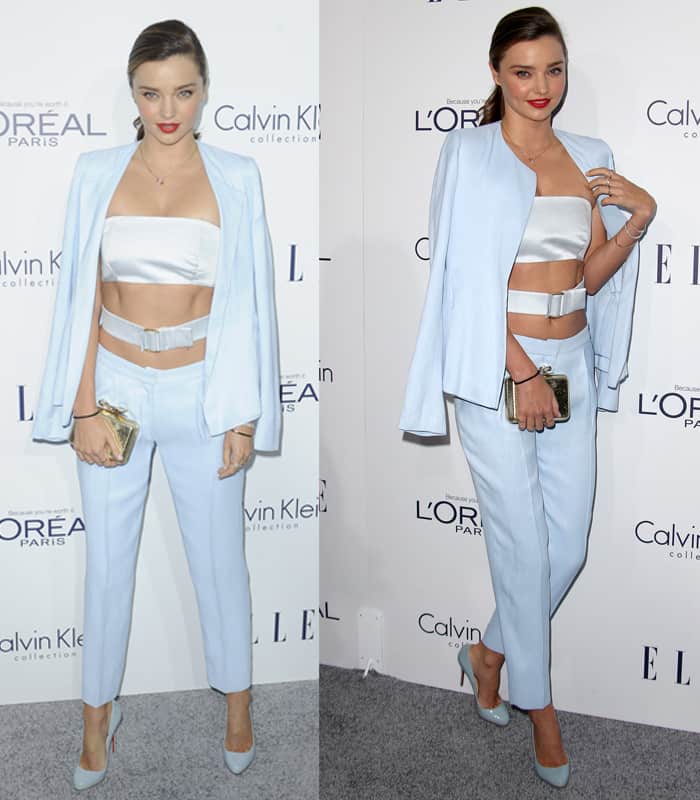 Miranda Kerr bared her toned stomach in a baby blue bandeau top with a belt embellishment