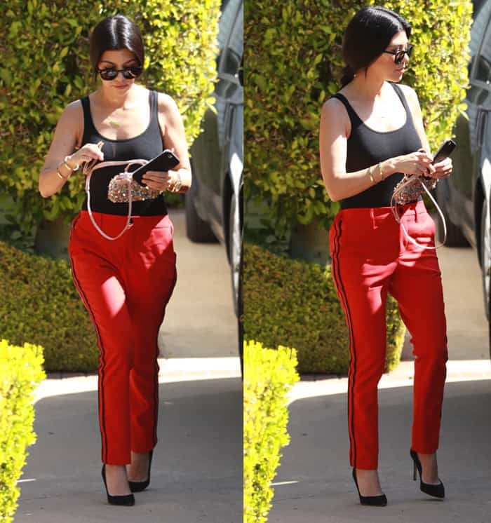Kourtney Kardashian paired her red track pants with a tank top